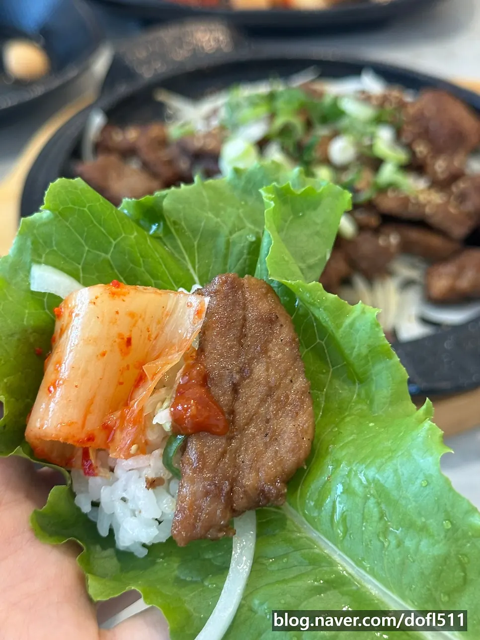 Stone-grilled galbi wrapped in lettuce for a bite