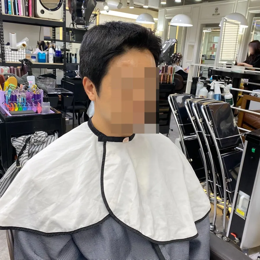 Grown-out men's short hair, before, back view