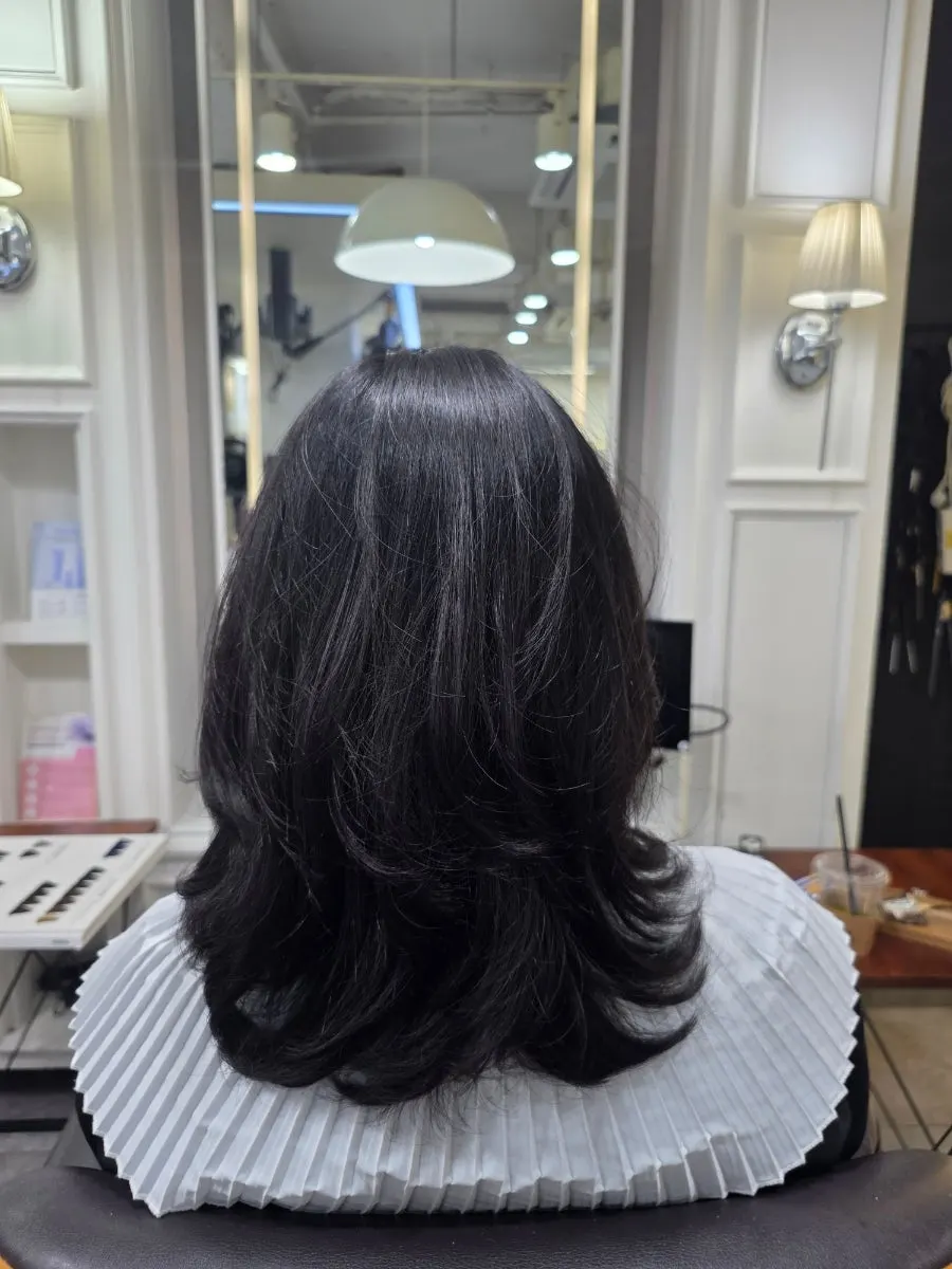 Side profile after the finished C-curl setting perm