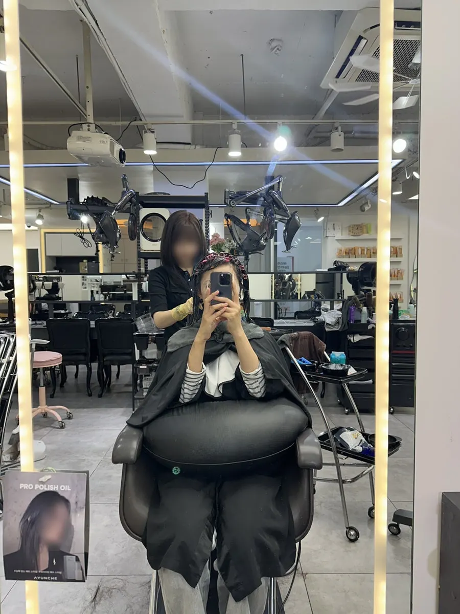 Layered cut in progress to medium length