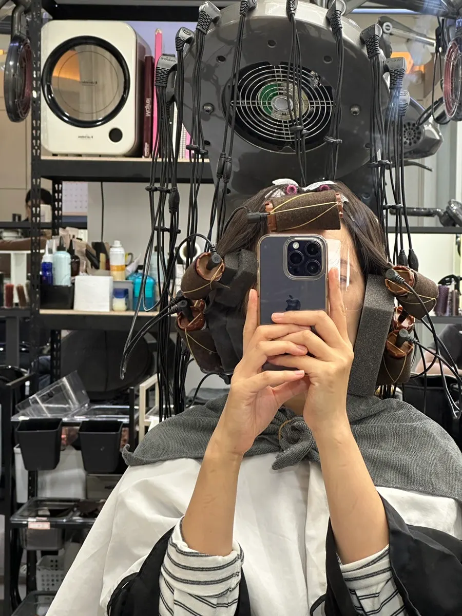 Hair mid-process with volume returning at the roots