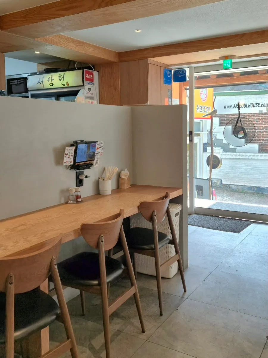 Interior with modern hanok structure and traditional Korean decor pieces