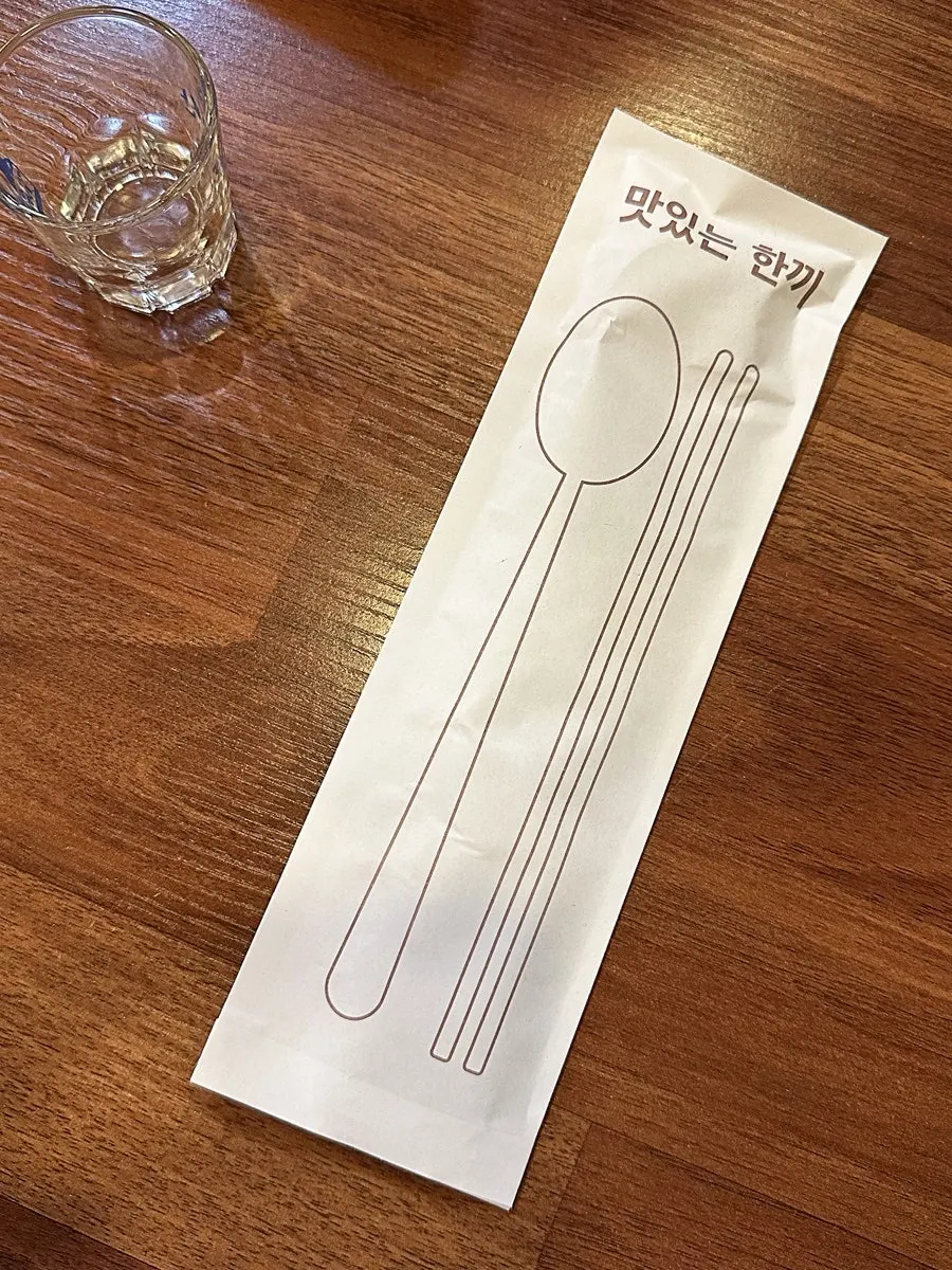 A neatly set dining table at Tamra Hansang