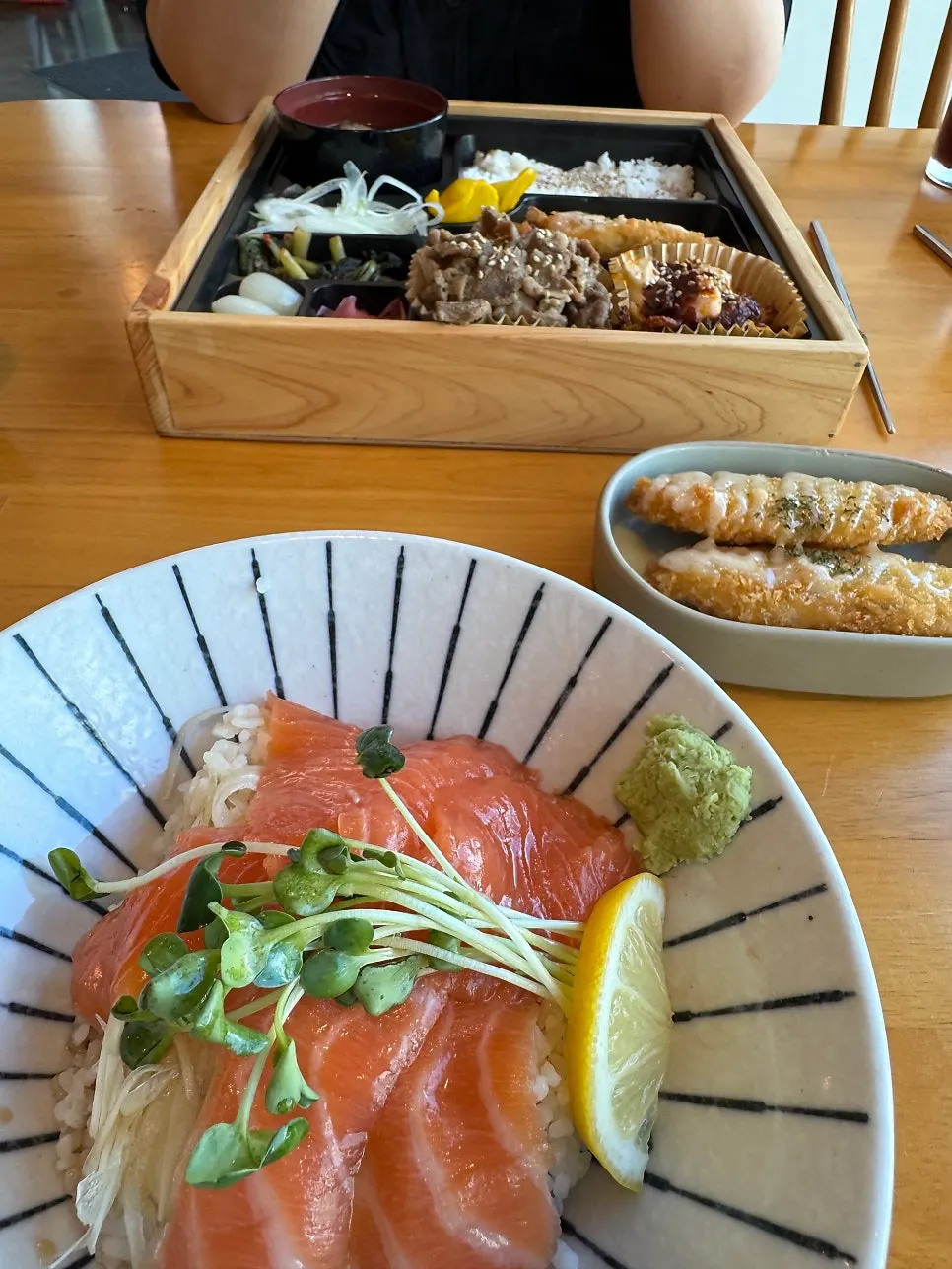 A bowl of sake-don with salmon and rice mixed together