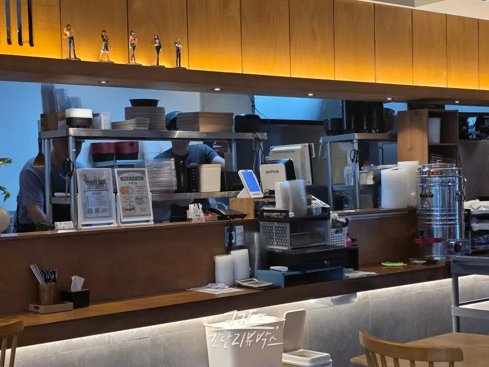 Open kitchen cooking scene at Jejju Donghong Branch