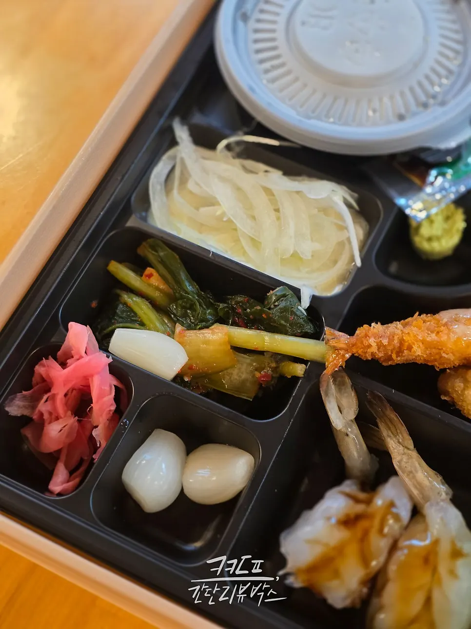 Jejju bento with octopus, fried items, and sushi