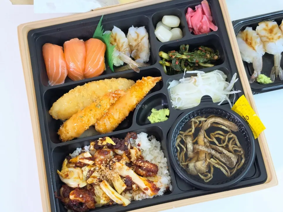 Jejju lunchbox with sushi, tempura and stir-fried octopus