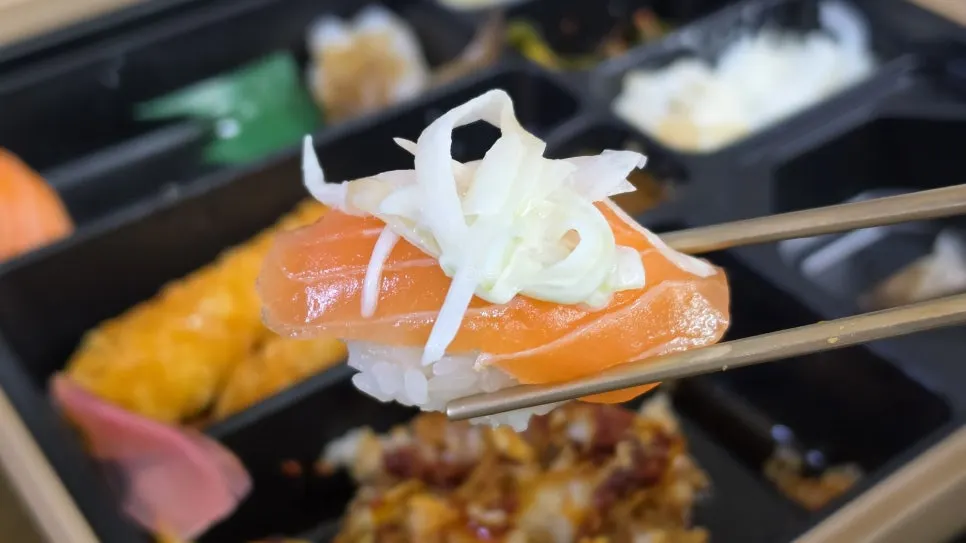 Close-up of thick-cut raw salmon sushi