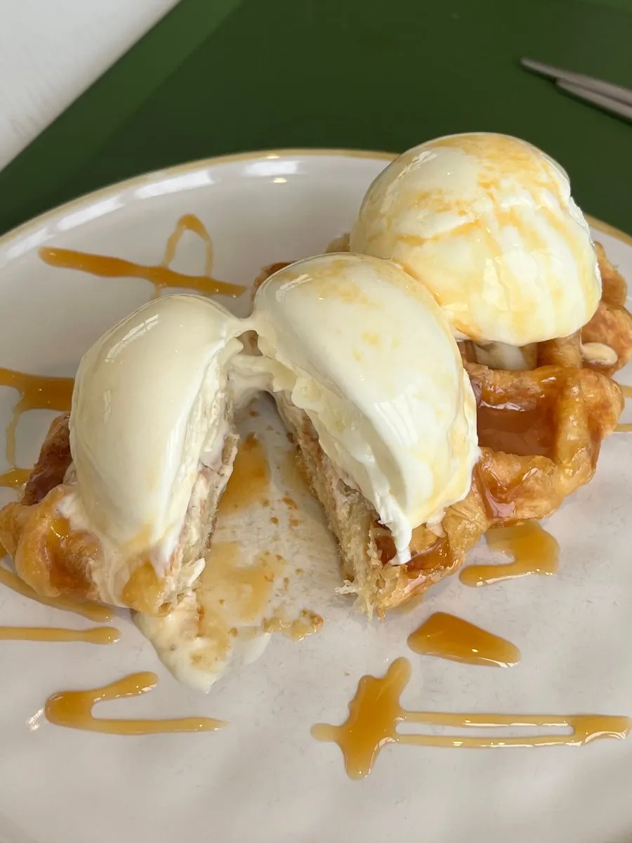 Cross-section of a crispy croffle with ice cream