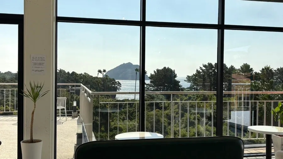 Café view where the sea and forest meet