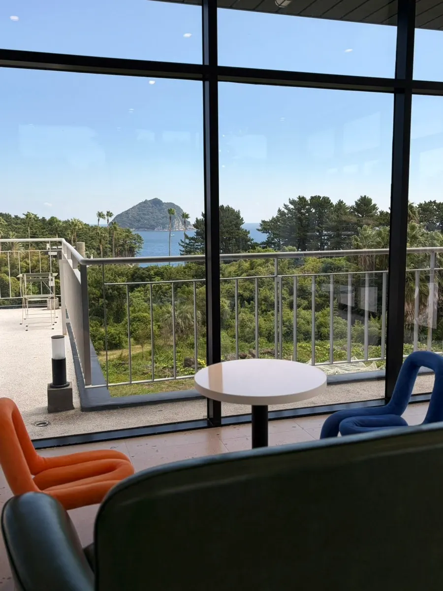Second-floor café seating with a view of Seopseom Island