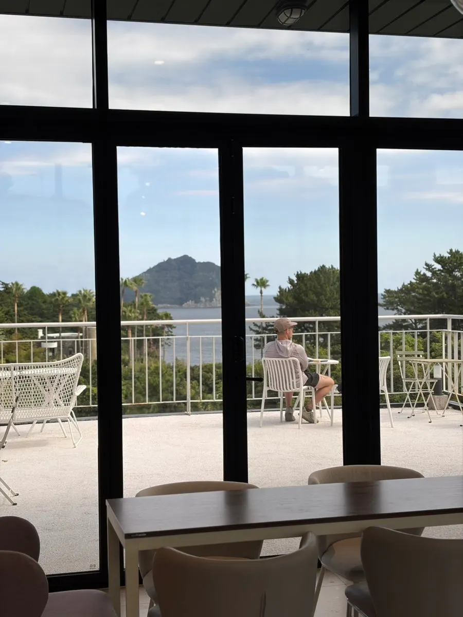 Latte and sandwich enjoyed at a terrace table