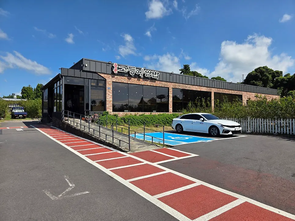 Restaurant exterior with black walls and red brick