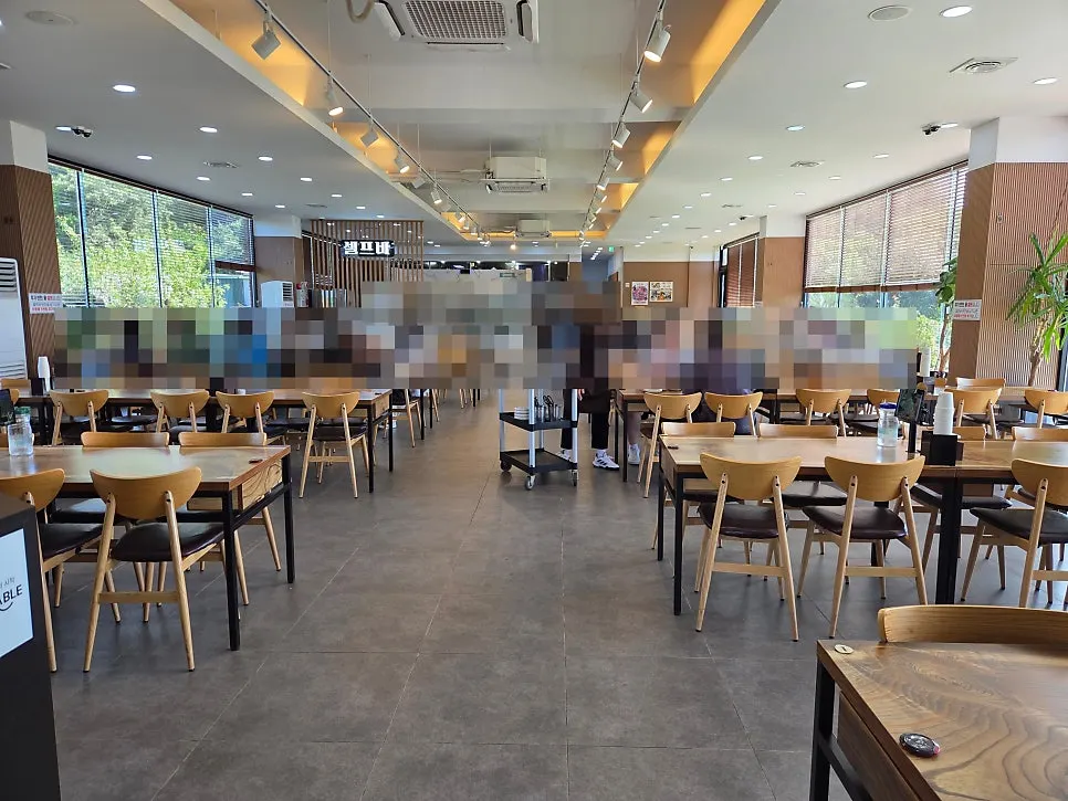 Spacious restaurant dining room with natural light by the windows