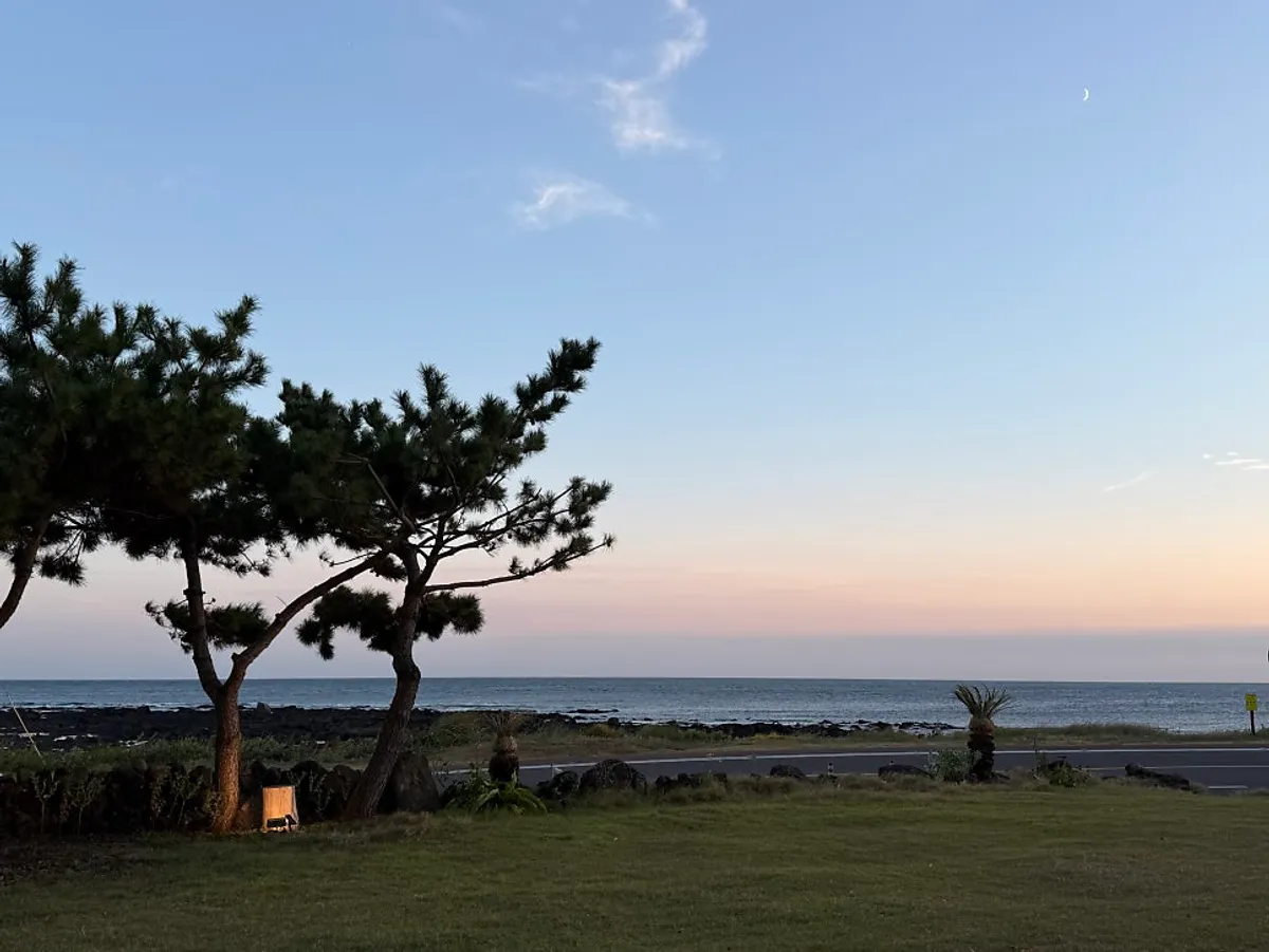 Sunset view of the Seogwipo sea from Jeju Healing Dwaeji