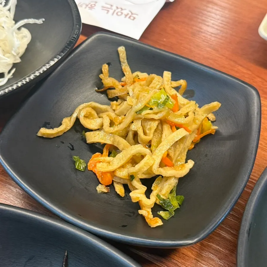 Side dishes including soy-marinated shrimp and seasoned tot