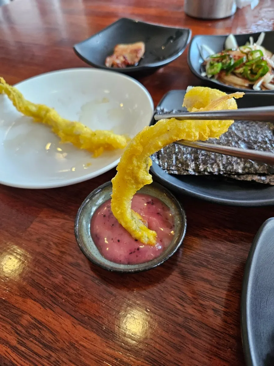 Fried cutlassfish served with a tangy dipping sauce