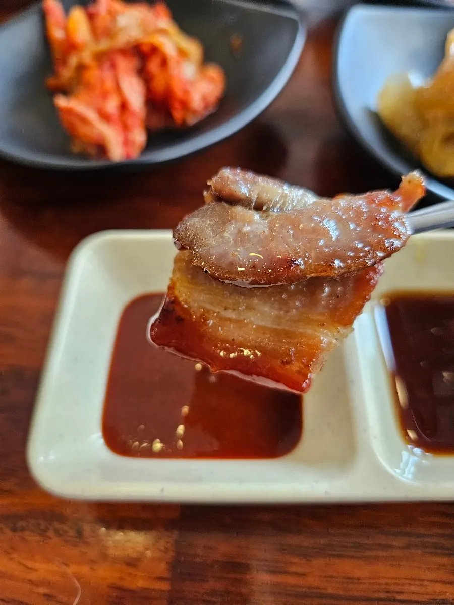 Fried cutlassfish dipped in blueberry-strawberry sauce