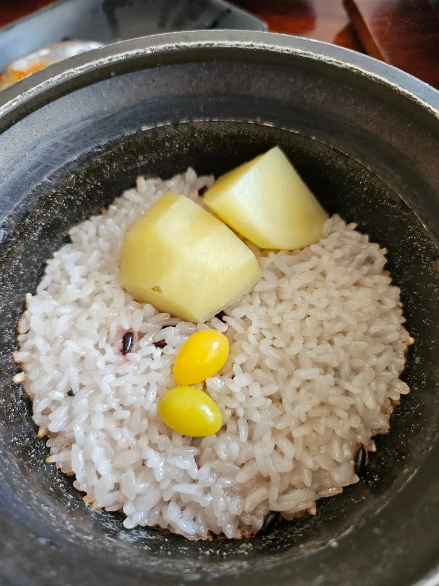 Stone pot rice topped with potato and ginkgo nuts