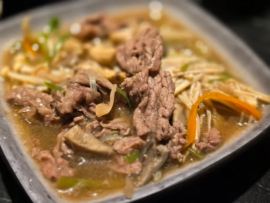 Hotpot broth served alongside rice