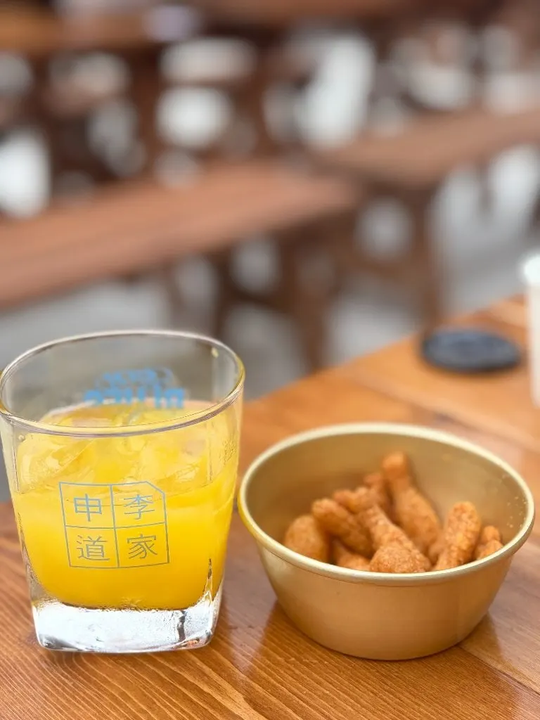Welcome drink orange juice served in a cat-print cup