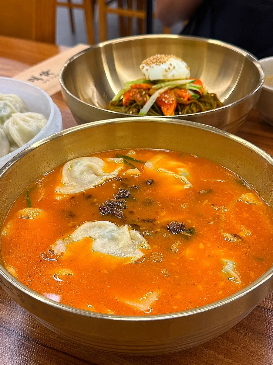 A steaming bowl of spicy sujebi