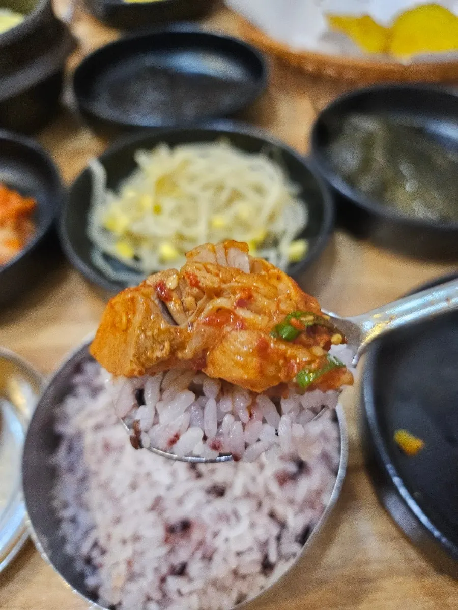 Seaweed, perilla leaf, and beansprouts stacked with galbijjim on top