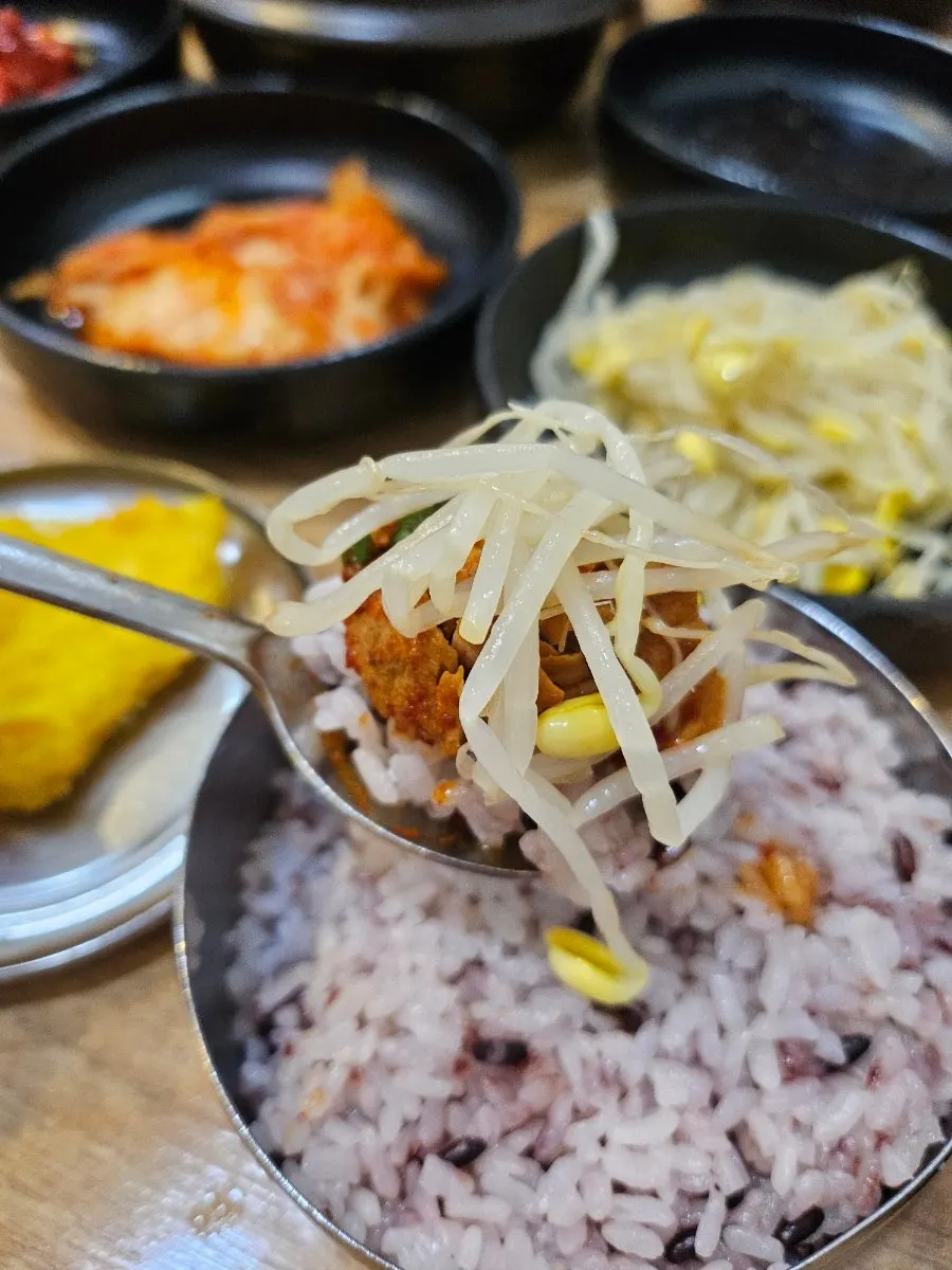 Rice mixed into galbijjim broth topped with meat