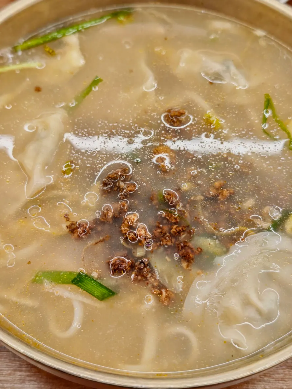 Kalguksu topped with chunky ground meat