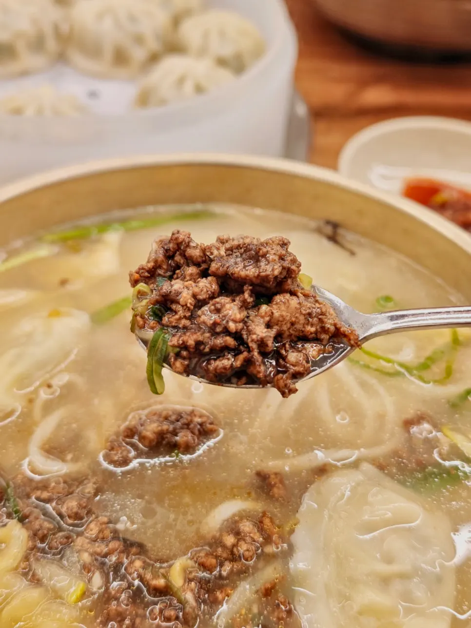 Kalguksu broth with noodles and topping mixed together