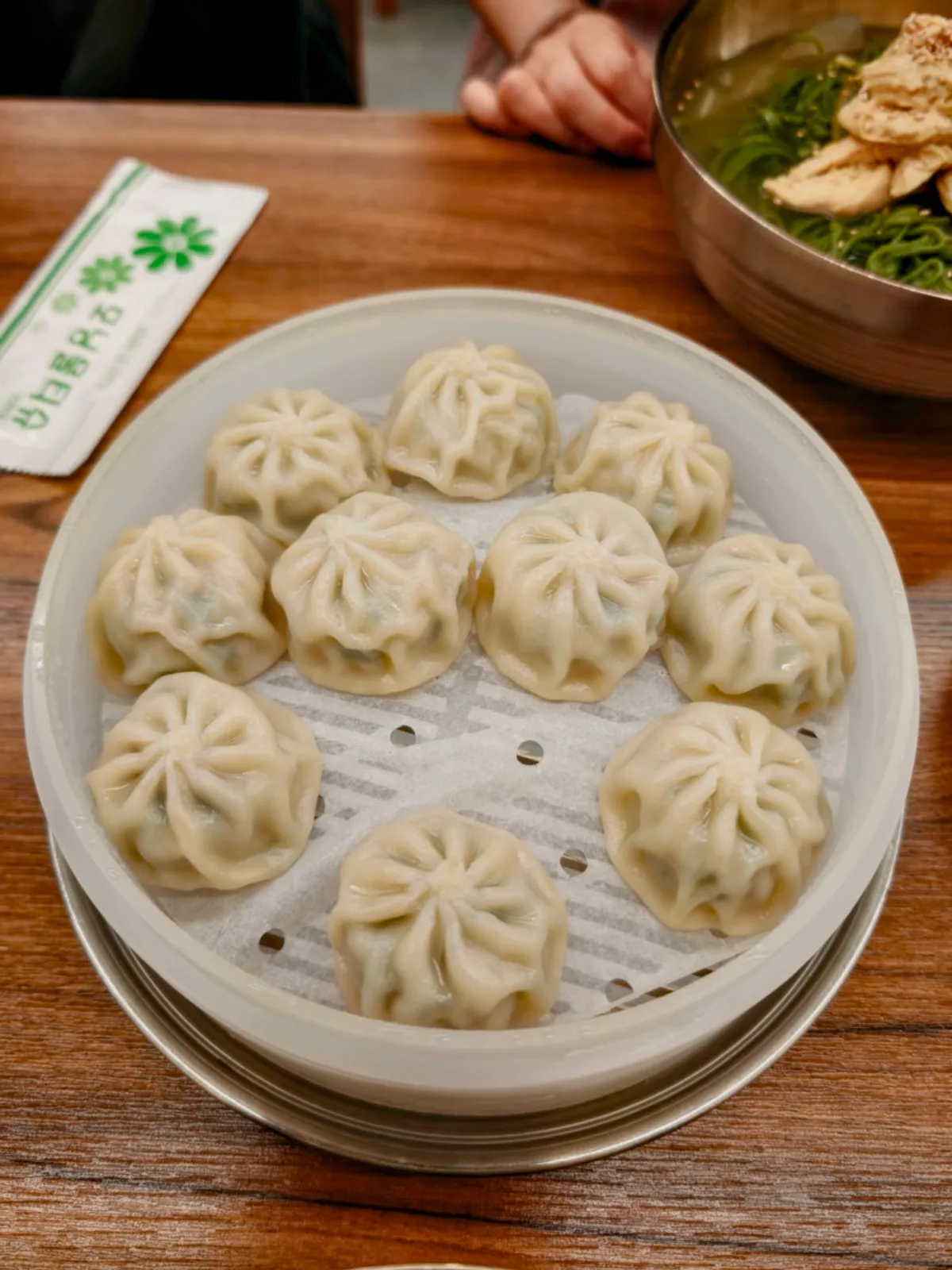 A plate of freshly steamed gyoza dumplings from Gangnam Gyoja