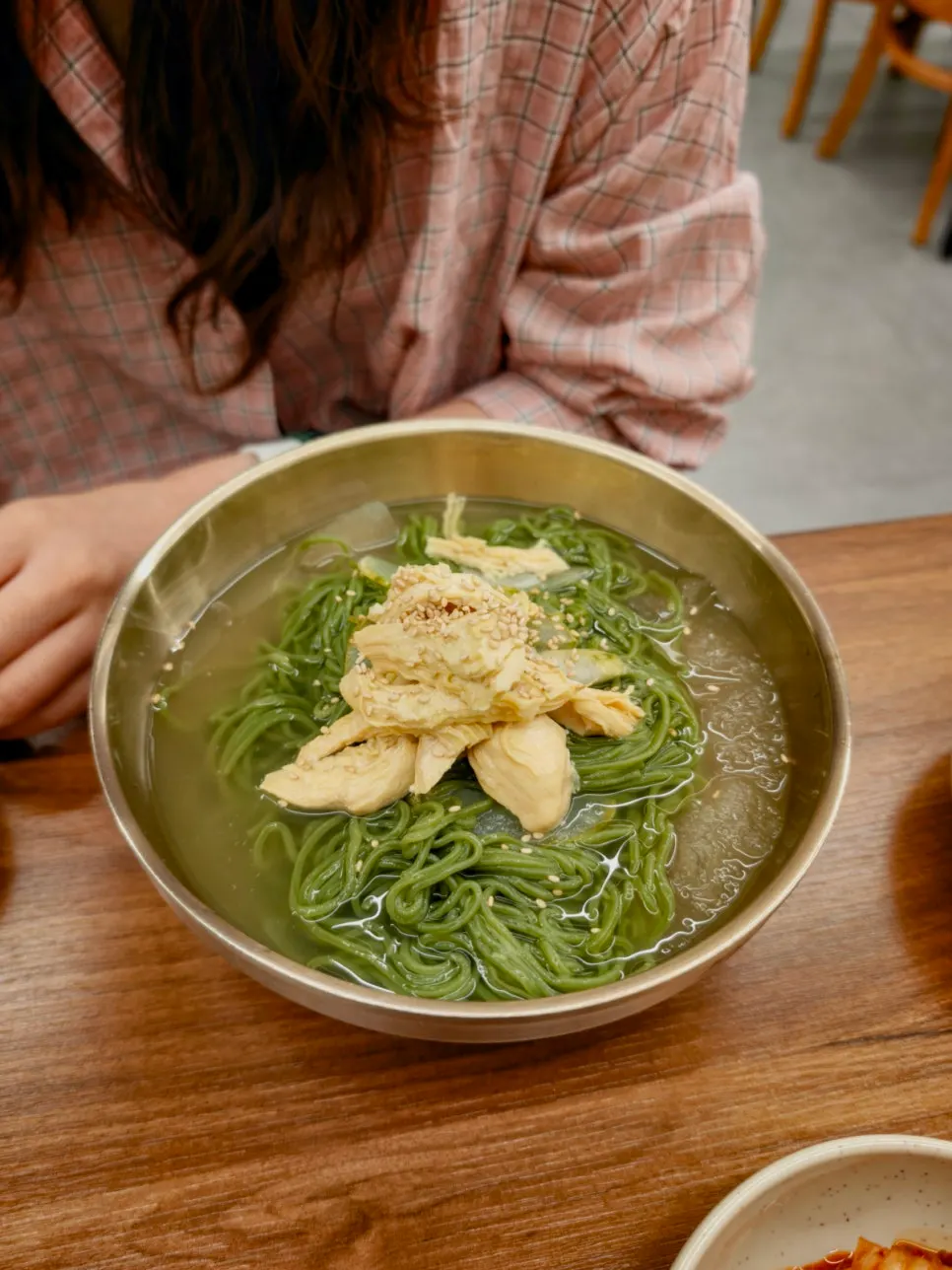 A bowl of chojegooksu with cold broth