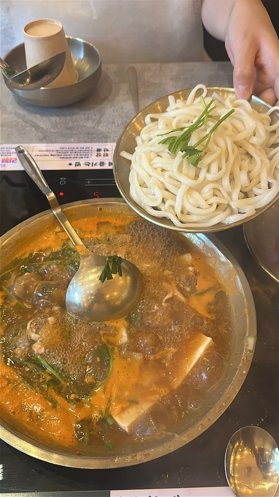 Beef pork-belly doenjang hot pot releasing an earthy aroma