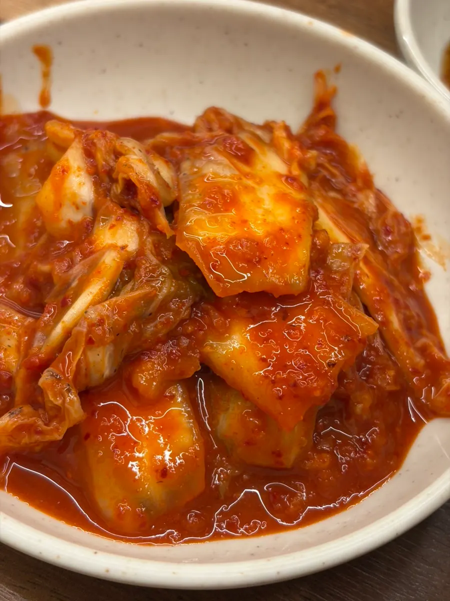 The bright red kimchi served as a standard side