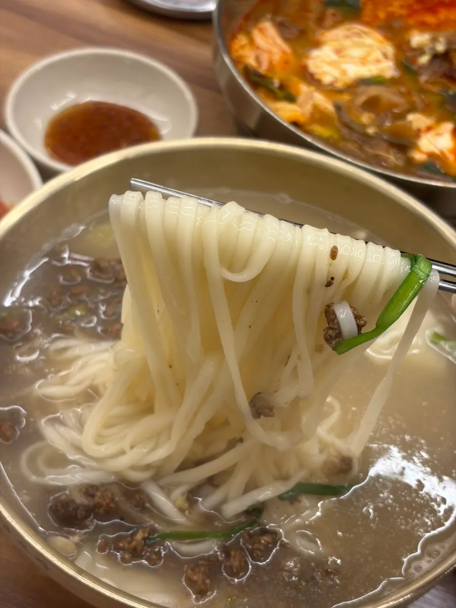 A bowl of kalguksu with rich broth