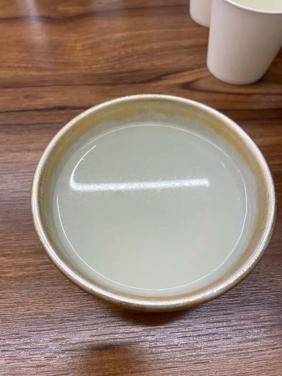 The bottle of makgeolli ordered along with a bowl