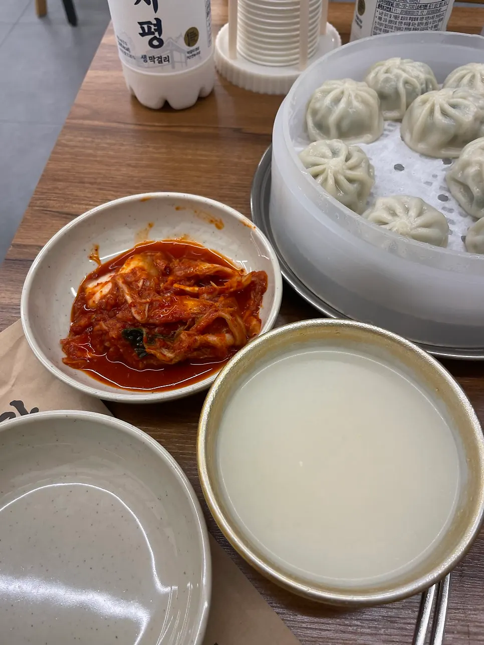 Makgeolli poured into the traditional bowl