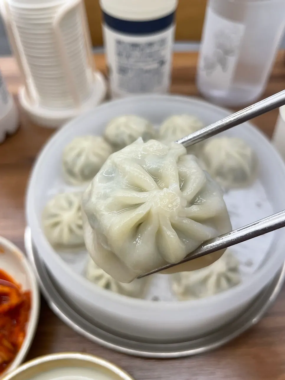 Gyoza dumplings served with kalguksu kimchi