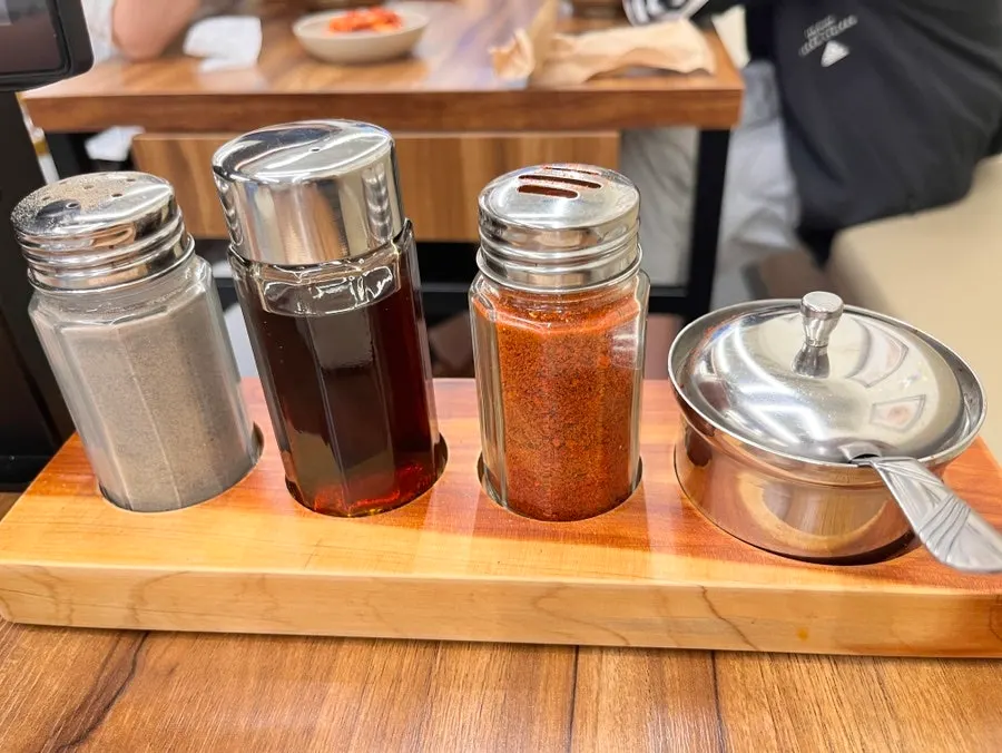 Soy sauce, vinegar, red pepper flakes and black pepper for mandu