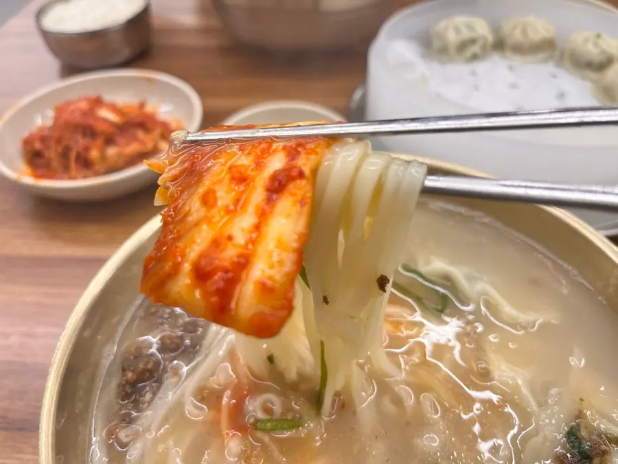 Kalguksu noodles eaten with kimchi