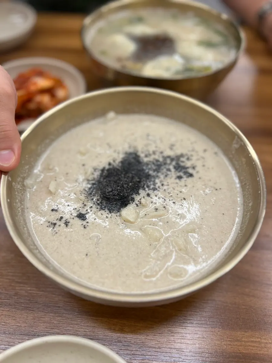 Kalguksu broth with seasoning sauce stirred in