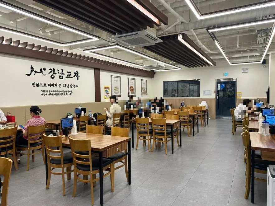 Interior of the restaurant with a clean kalguksu-shop feel