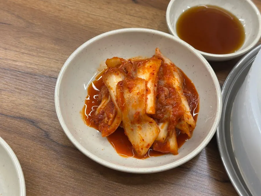 Kimchi served alongside the kalguksu