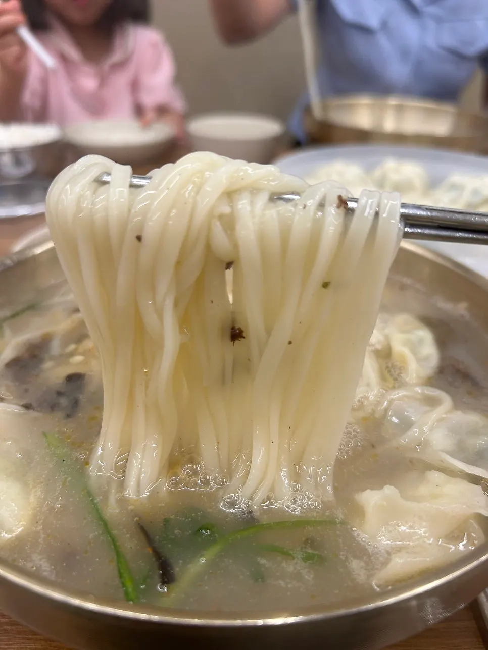 Rich kalguksu topped with meat