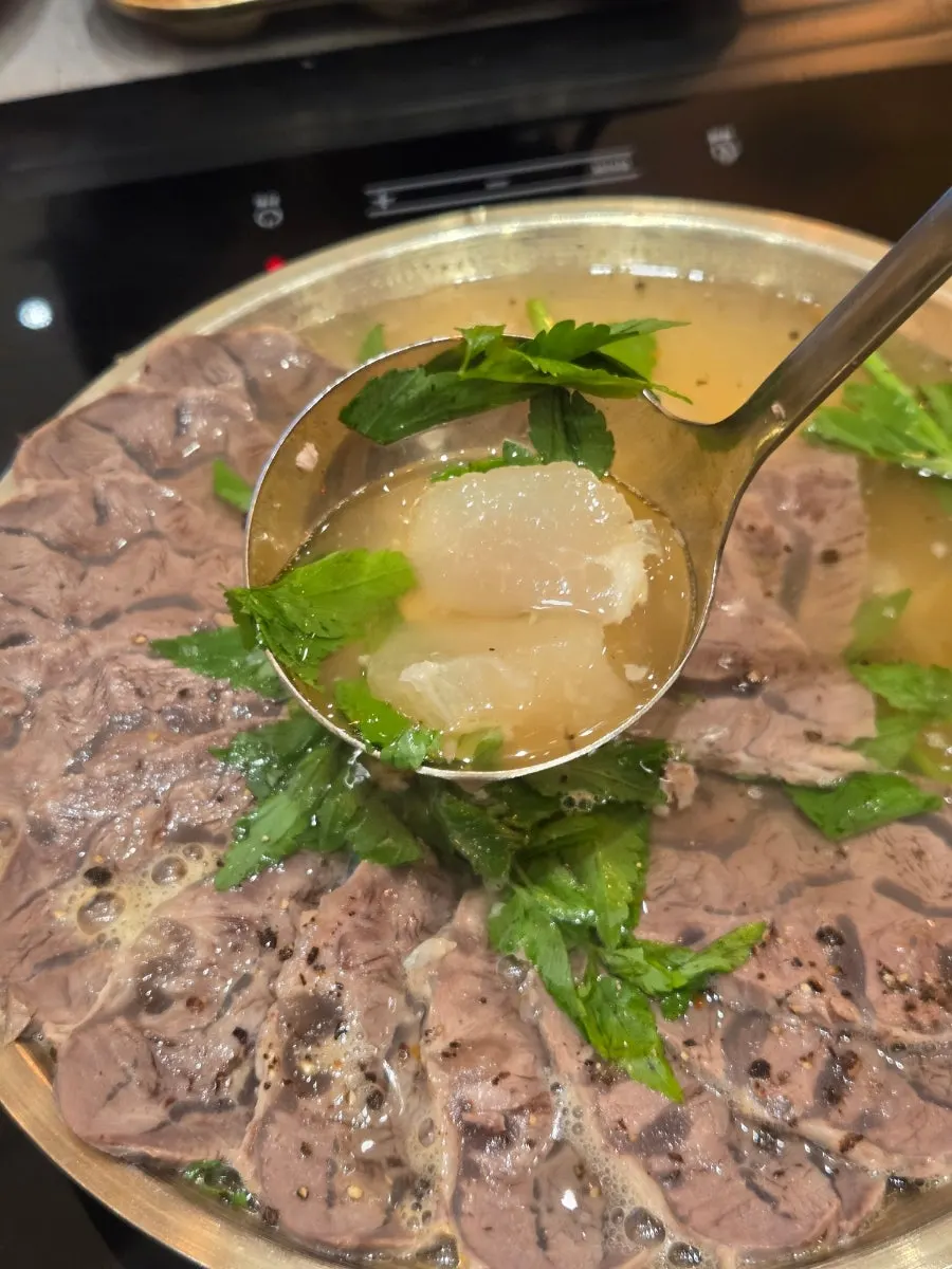 A pot of assorted boiled pork hot pot before cooking