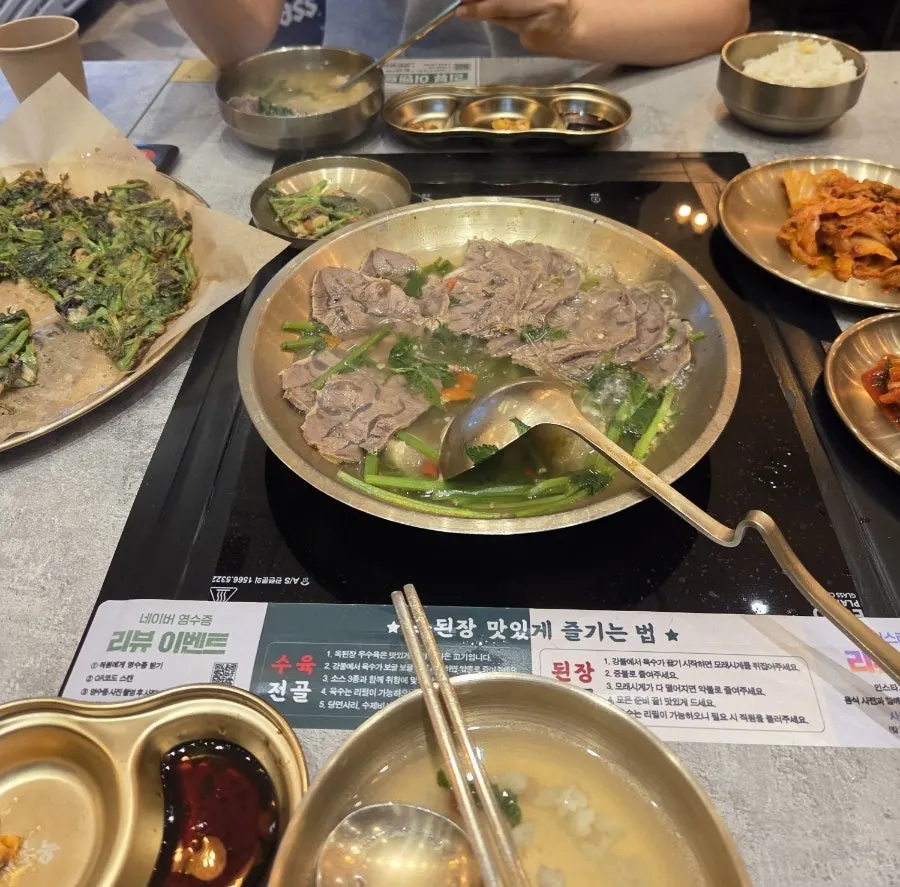 Assorted boiled pork hot pot broth simmering