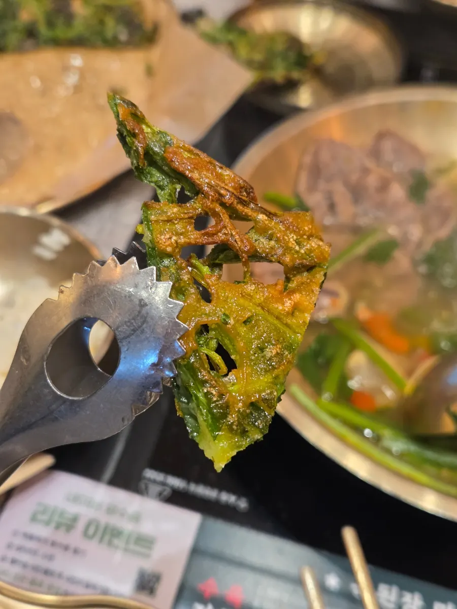 A piece of the pancake packed with freshwater snails