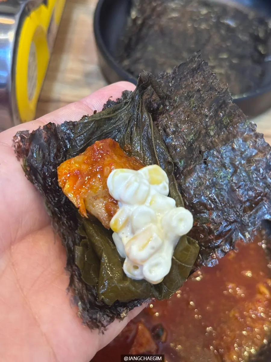 A bowl of flat glass noodles coated in sauce