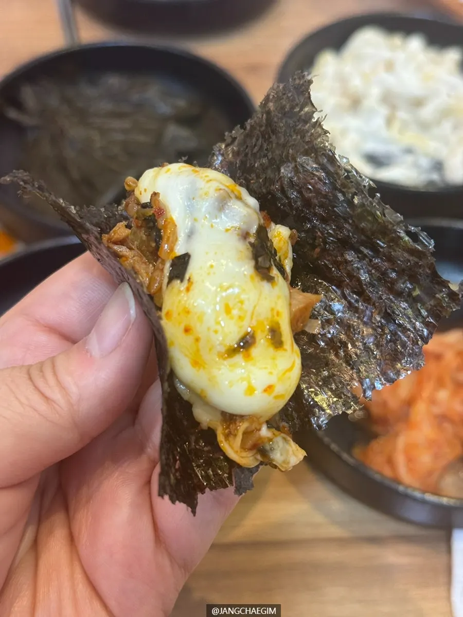 A spoonful of cheese fried rice lifted up