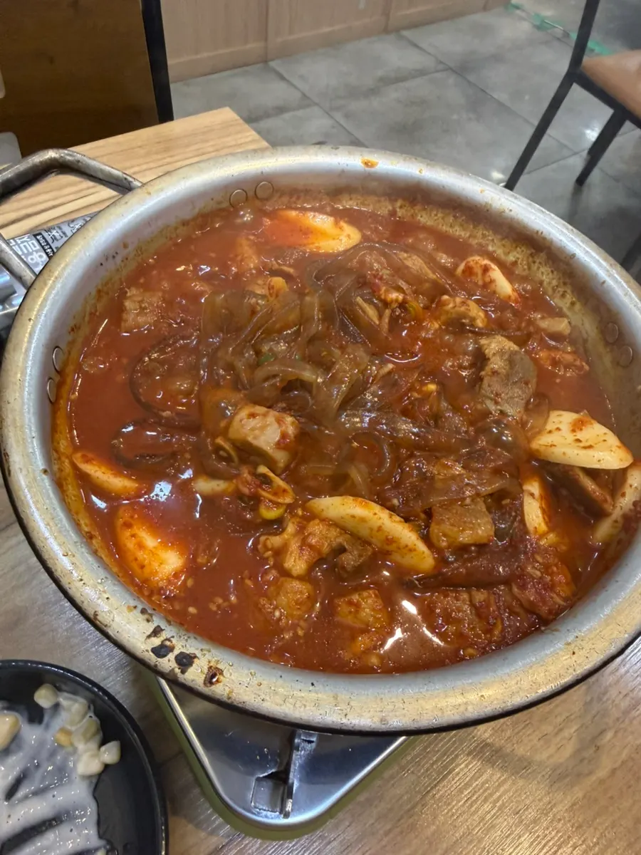 A bite of meat with spicy galbijjim broth